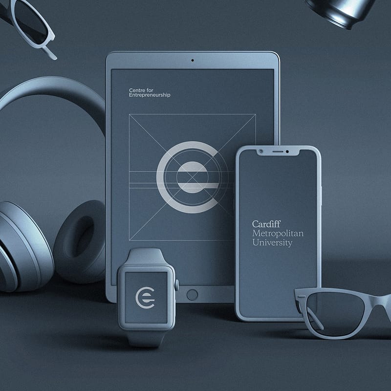 The Centre for Entrepreneurship branding identity shown on an iPad, iPhone and Apple Watch, using the steel blue colour throughout the entire image by Graphic design agency Cardiff.